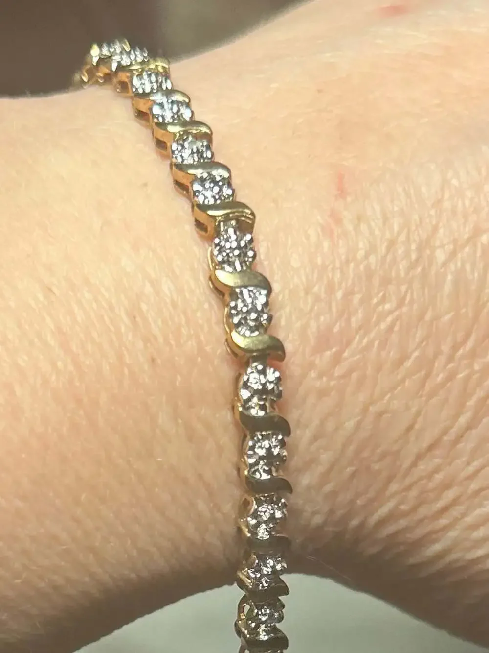 Roman Gold Tone Cubic Zirconia Tennis Bracelet with S-Curve Accents